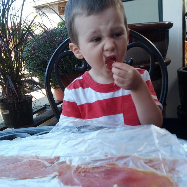 Boy eating ham