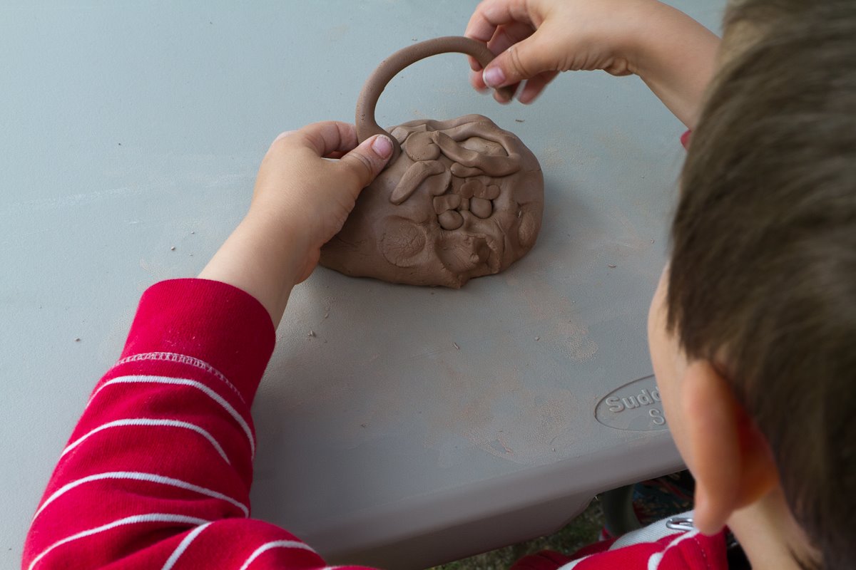 boy working with clay